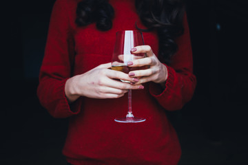 Girl holding glass of wine
