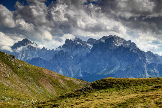 Clouds over Carnic Alps grassy slopes and Cima Bagni, Monte Popera, Sextner Rotwand Croda Rossa di Sesto, Elferkofel Cima Undici peaks, Sexten Dolomites Val Comelico Belluno, Alto Adige Sudtirol Italy