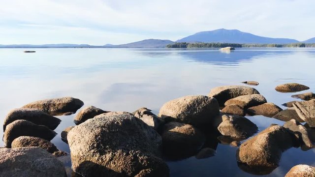Maine granite rocks, clear water, and Mt Katahdin