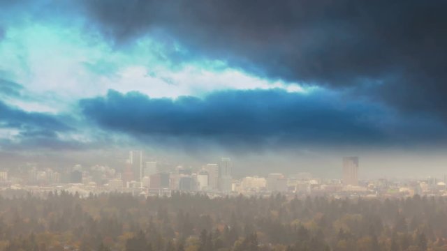 Ultra high definition time lapse movie of fast moving stormy clouds over Portland Oregon downtown cityscape during fiery sunset in colorful Autumn season 3840x2160 UHD