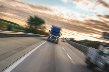 Motion blur semi truck 18 wheeler - obrazy, fototapety, plakaty