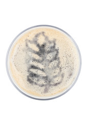 Glass of stout beer top with wheat shape