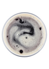 Glass of dark stout beer top view with foam