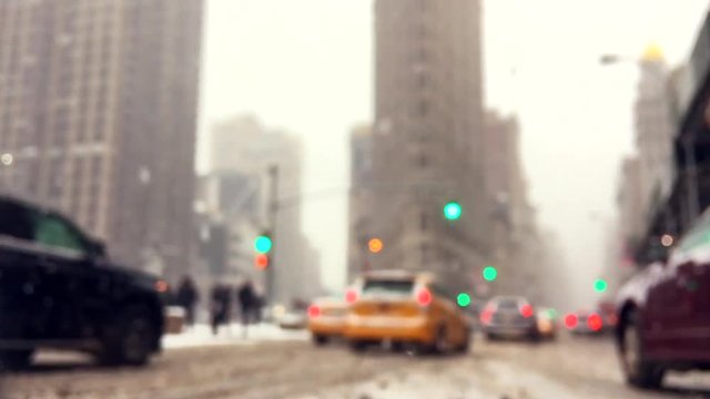 Traffic moving through clogged streets of Manhattan during a snow storm in New York City