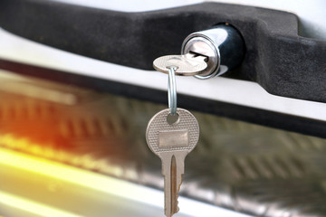 Close up of key at car door or truck door. Key car insert to key door with copy space.