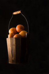 oranges in a wooden basket