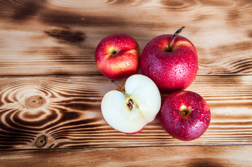 red apples on burned boards