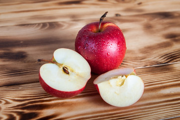 red apples on burned boards