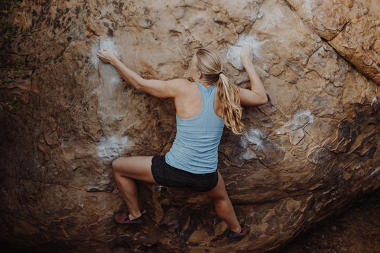 Blonde Woman Climbing Outside