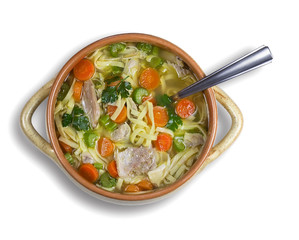 Bowl of chicken soup on white background. High-angle shot.