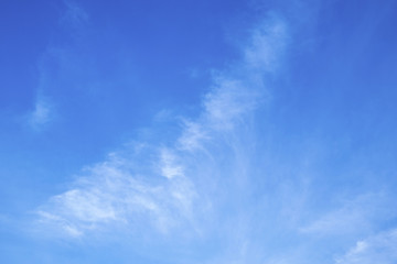 Naklejka na ściany i meble Blue sky background with white clouds.