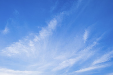 Pink sky background with white clouds.