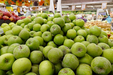fresh apples on the counter in the store