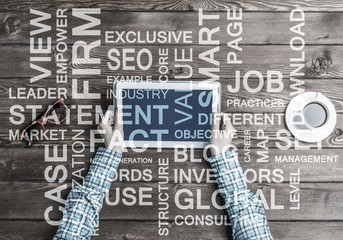 Close view of woman in checked shirt at her workplace