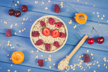 Vintage photo, Oatmeal and oat flakes with fruits, healthy lifestyle and nutrition concept