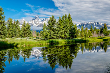 Mountains in Grand Teton National Park with reflection in Snake River