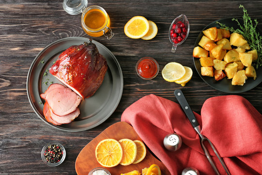 Composition with traditional sliced honey baked ham on table