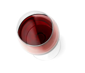 Glass with red wine on white background