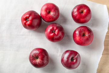Ripe red apples on table