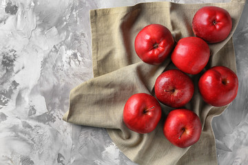 Ripe red apples on table