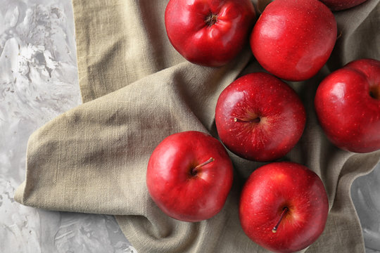 Ripe red apples on table