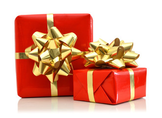 Red gift box with gold bow isolated on white