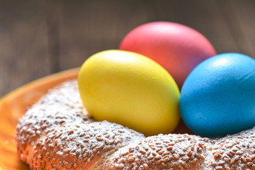 Colorful festive easter eggs and easter sweet baking