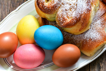 Colorful festive easter eggs and easter sweet baking