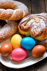 Colorful festive easter eggs and easter sweet baking
