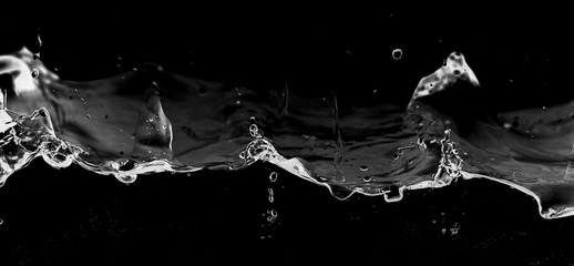 Water smooth with splashes on a black background