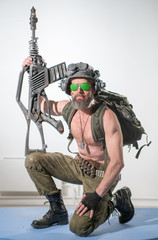 Modern soldier in an unusual helmet and with an unusual automatic weapon