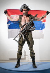 Modern soldier in an unusual helmet and with an unusual automatic weapon