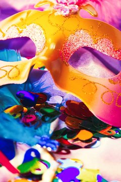 Carnival mask with streamers and confetti