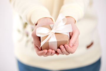 hands holding craft gift box