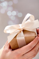 hands holding craft gift box