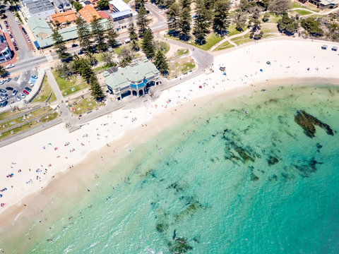 Aerial photograph over a busy Cottesloe Beach, Perth, Western Australia, on a clear summer afternoon. 