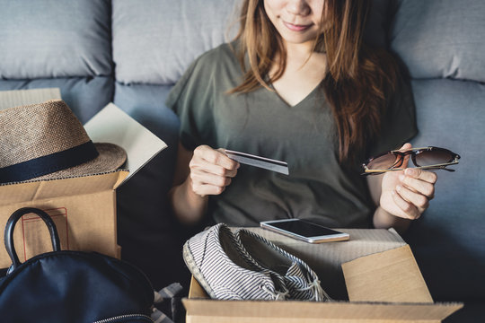 Young Woman Received Online Shopping Parcel Opening Boxes