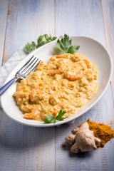 shrimp with curry ginger and coconut sauce, selective focus
