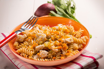 pasta with chicken and carrots, selective focus