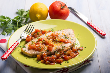 swordfish with fresh tomatoes and grated lemon peel,selective focus