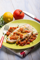 swordfish with fresh tomatoes and grated lemon peel,selective focus