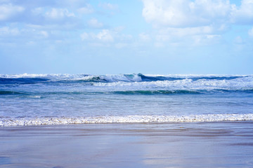 Beautiful wave on the beach. Early morning and strong wind. Cloudy morning.