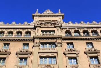 Facade of a historical building on the famous avenue of Gran Via in Madrid, Spain