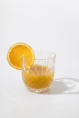 Orange juice with orange slice in a crystal glass