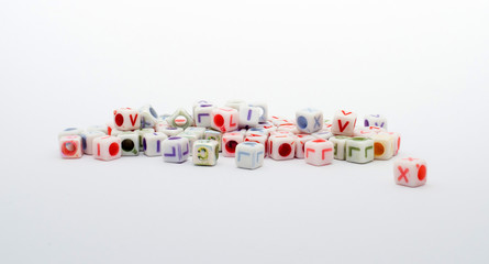 a lot of colorful cubes with letters on a white background