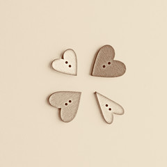 four buttons in the form of a heart on paper.