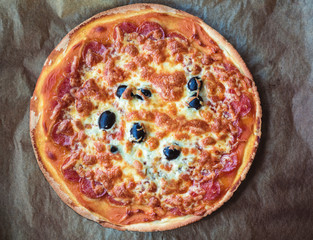 Homemade pizza set on paper