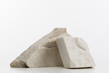 Minimalist composition with two marble rocks on white desk, interior decor, workspace decoration
