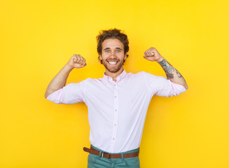 Cheerful man showing muscles