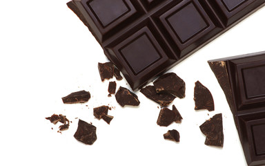 Broken chocolate bar isolated on white